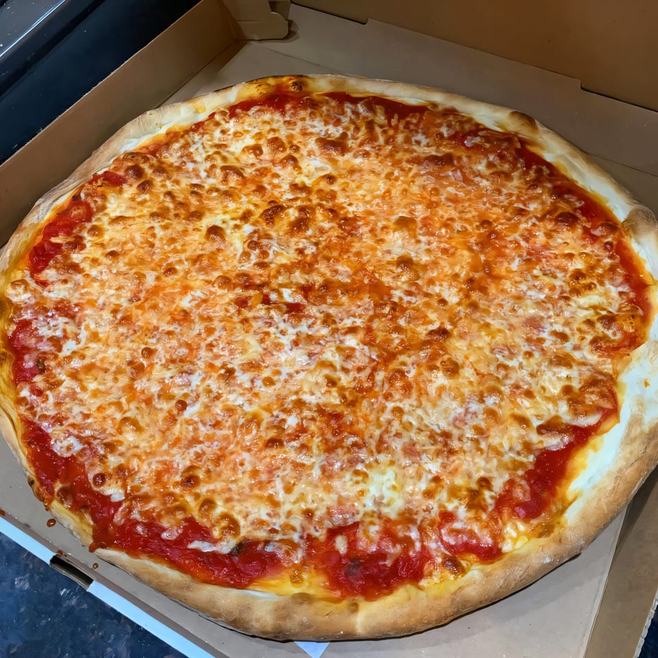 A large, round Via Roma Pizza cheese pizza with red sauce and melted cheese in a cardboard box.